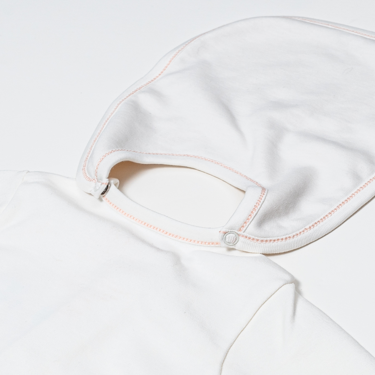 Pack of Bibs - Detail showing bib snapping directly on to the babysuit